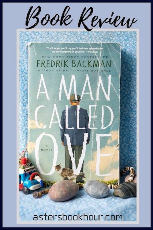 The pinterest image for A Man Called Ove by Fredrik Backman book review. There is a blue floral print background with the novel centered in the middle and the cover facing the front. The words book review are in fake cursive over the top.