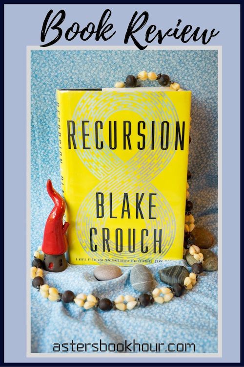 The pinterest image for Recursion by Blake Crouch book review. There is a blue floral print background with the novel centered in the middle and the cover facing the front.