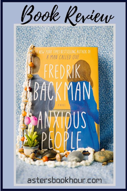 The pinterest image for Anxious People by Fredrik Backman book review. There is a blue floral print background with the novel centered in the middle and the cover facing the front.