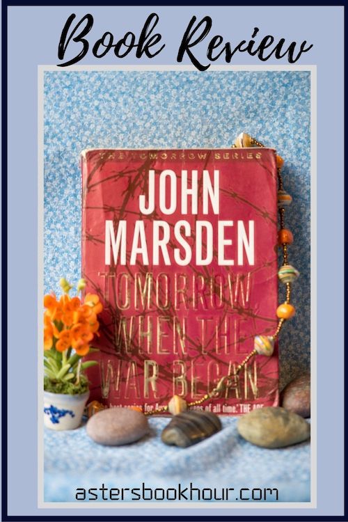 The pinterest image for Tomorrow, When the War Began by John Marsden book review. There is a blue floral print background with the novel centered in the middle and the cover facing the front.