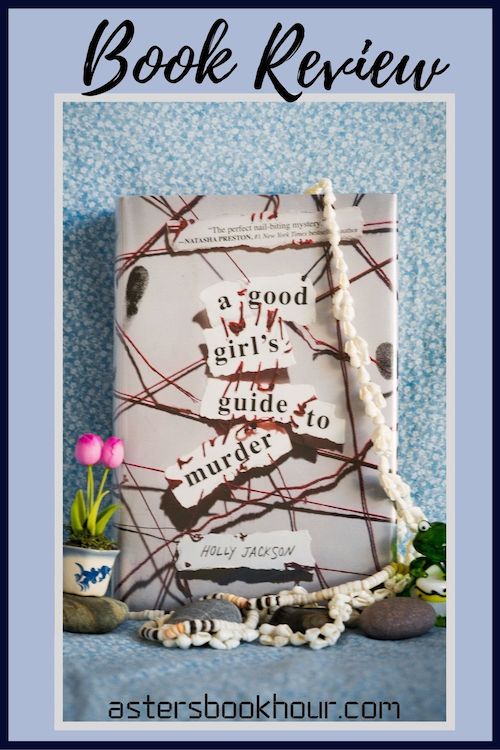 The pinterest image for A Good Girl's Guide to Murder by Holly Jackson book review. There is a blue floral print background with the novel centered in the middle and the cover facing the front.