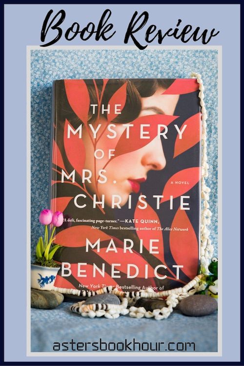 The pinterest image for The Mystery of Mrs. Christie by Marie Benedict book review. There is a blue floral print background with the novel centered in the middle and the cover facing the front.