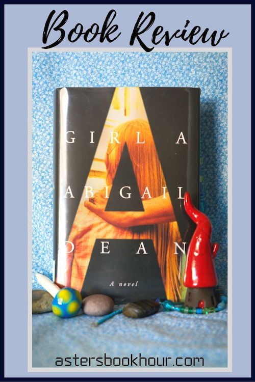 The pinterest image for Girl A by Abigail Dean book review. There is a blue floral print background with the novel centered in the middle and the cover facing the front.