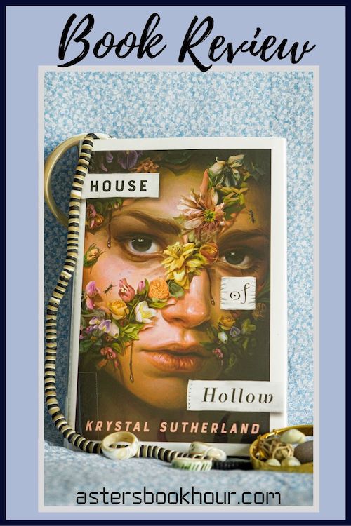 The pinterest image for House of Hollow by Krystal Sutherland book review. There is a blue floral print background with the novel centered in the middle and the cover facing the front.