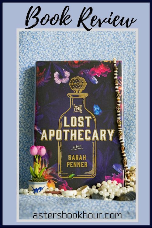 The pinterest image for The Lost Apothecary by Sarah Penner book review. There is a blue floral print background with the novel centered in the middle and the cover facing the front.