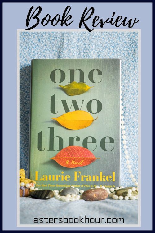 The pinterest image for One Two Three by Laurie Frankel book review. There is a blue floral print background with the novel centered in the middle and the cover facing the front.