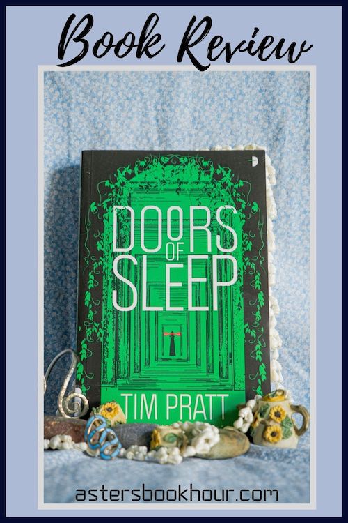 The pinterest image for Doors of Sleep by Tim Pratt book review. There is a blue floral print background with the novel centered in the middle and the cover facing the front.