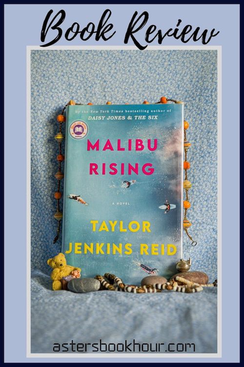 The pinterest image for Malibu Rising by Taylor Jenkins Reid book review. There is a blue floral print background with the novel centered in the middle and the cover facing the front.