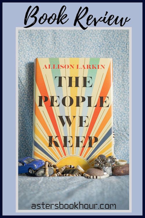 The pinterest image for The People We Keep by Allison Larkin book review. There is a blue floral print background with the novel centered in the middle and the cover facing the front.