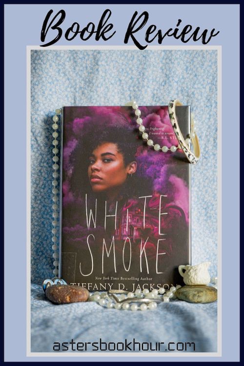 The pinterest image for White Smoke by Tiffany D. Jackson book review. There is a blue floral print background with the novel centered in the middle and the cover facing the front.