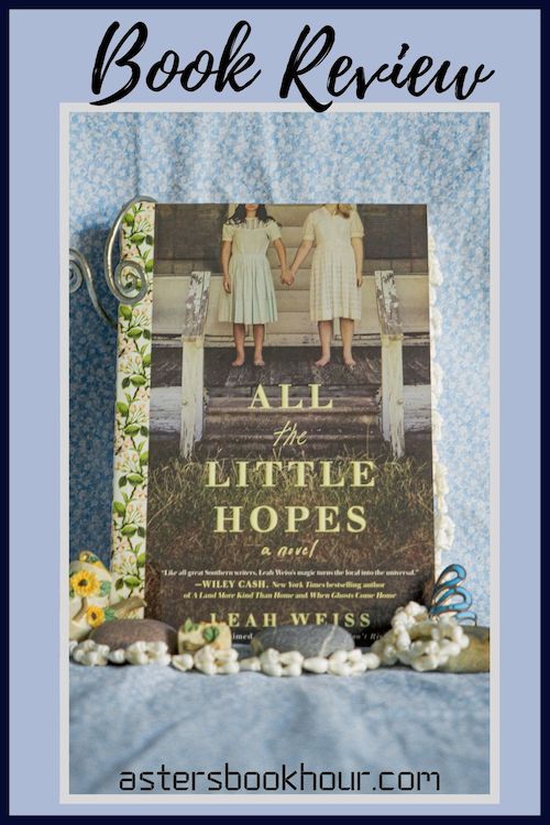 The pinterest image for All the Little Hopes by Leah Weiss book review. There is a blue floral print background with the novel centered in the middle and the cover facing the front.