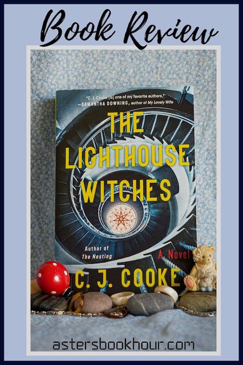 The pinterest image for The Lighthouse Witches by CJ Cooke book review. There is a blue floral print background with the novel centered in the middle and the cover facing the front.