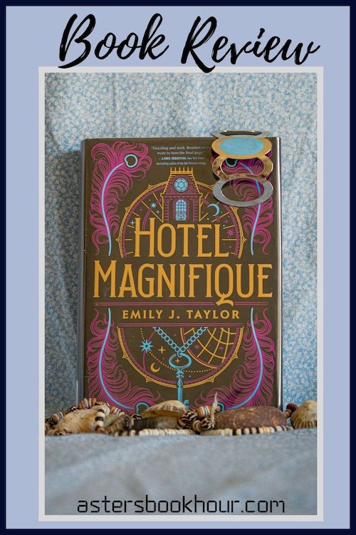 The pinterest image for Hotel Magnifique by Emily J. Taylor book review. There is a blue floral print background with the novel centered in the middle and the cover facing the front.