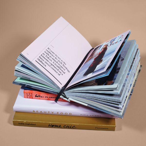 Aesthetic image of books stacked on top of each other for blog post: New 2022 Novels You Must Read | July - December
