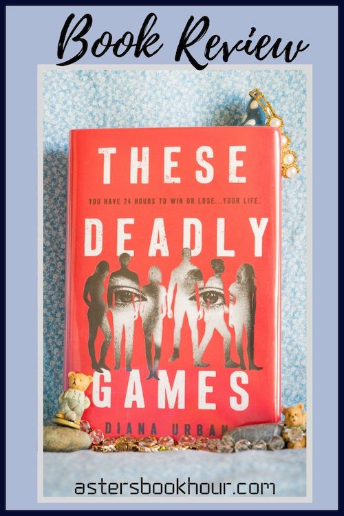 The pinterest image for These Deadly Games by Diana Urban book review. There is a blue floral print background with the novel centered in the middle and the cover facing the front.