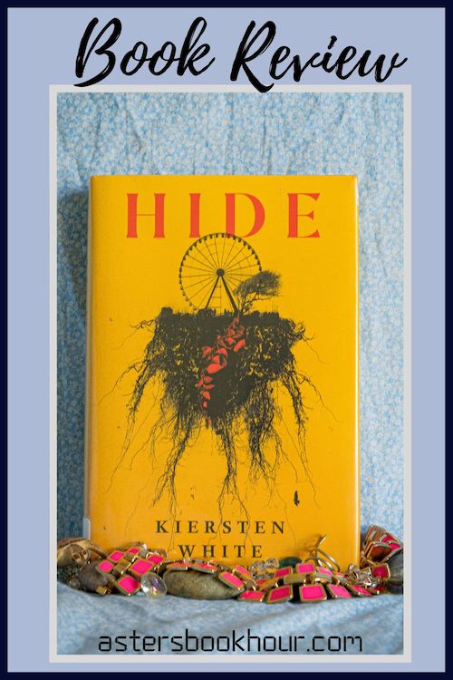 The pinterest image for Hide by Kiersten White book review. There is a blue floral print background with the novel centered in the middle and the cover facing the front.